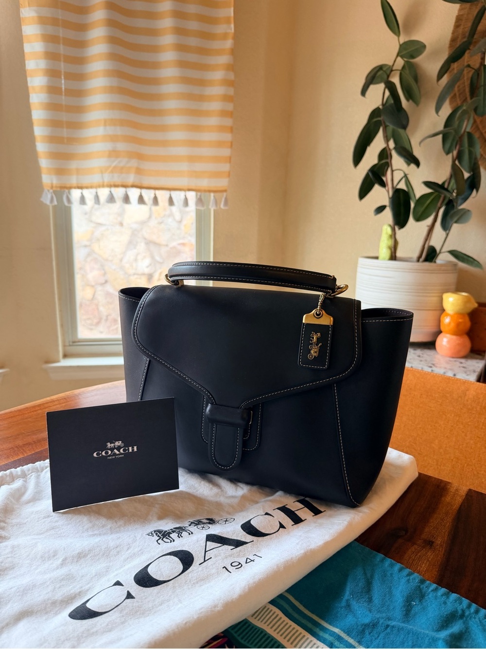 Coach Black Courier Carryall with striking white contrast stitching